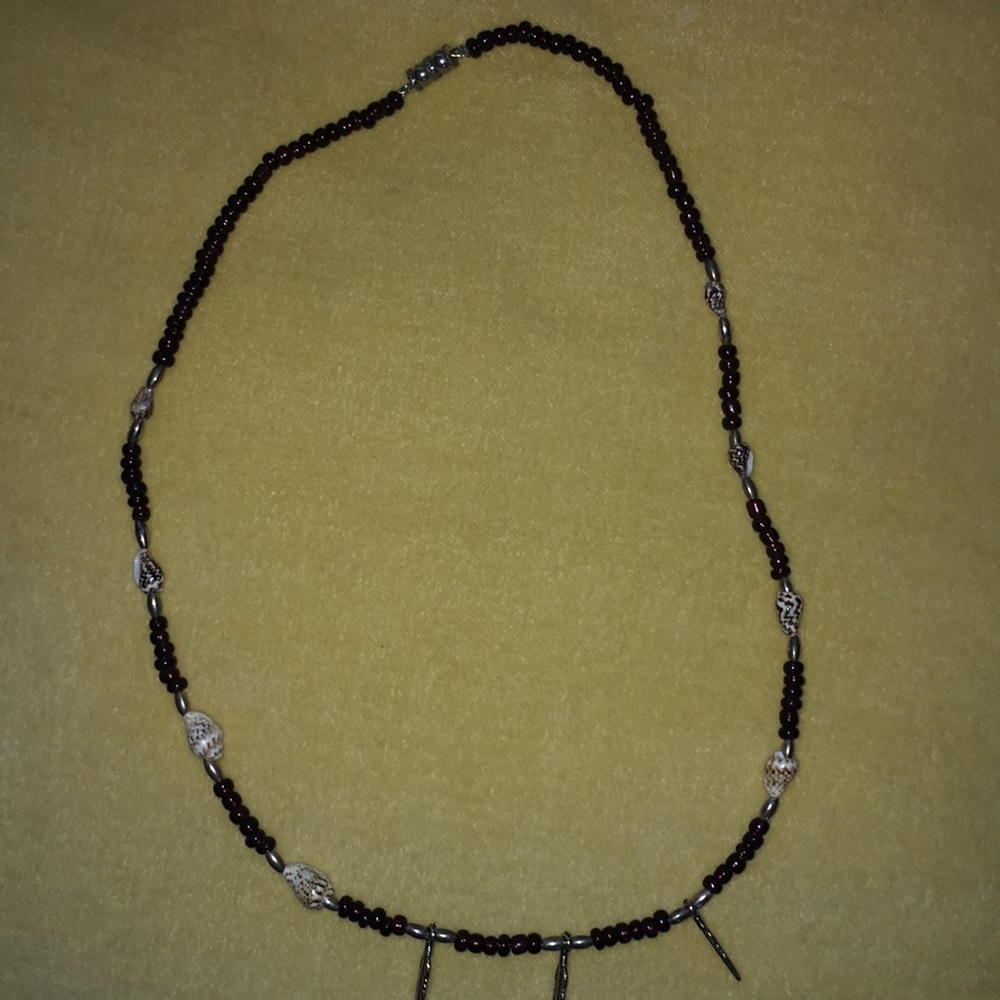 Beaded necklace with silver feather and shells